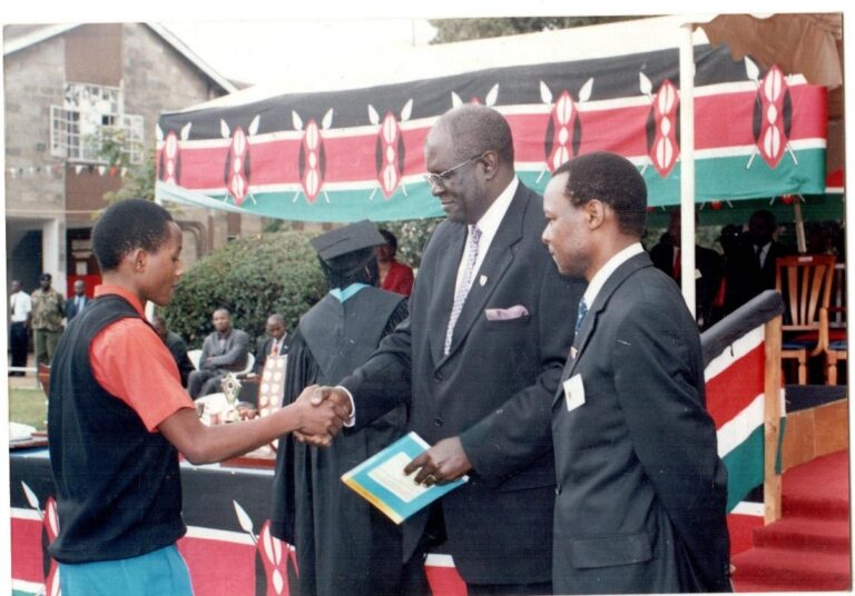 Dr. HONGO with Prof. George MAGOHA, the immediate past Cabinet Secretary, Responsible for Education in Kenya. Rewarding a STAREHE Student for a job well done