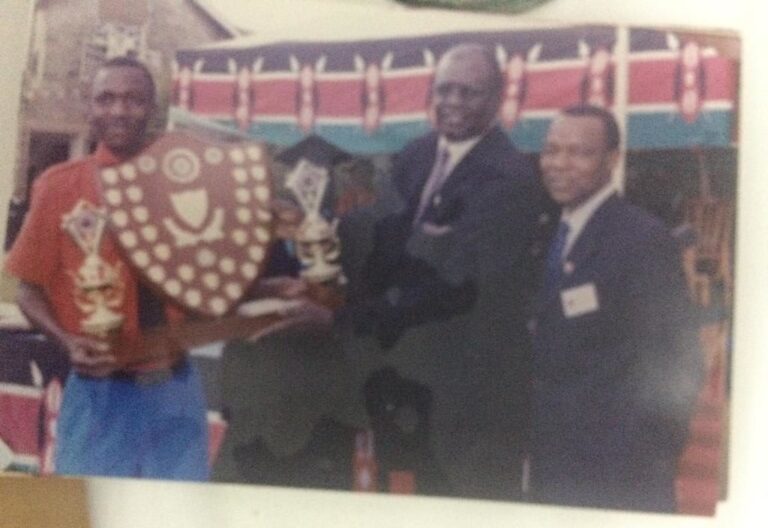 Dr. HONGO with Prof. George MAGOHA, the immediate past Cabinet Secretary, Responsible for Education in Kenya. Rewarding a STAREHE Student for a job well done.